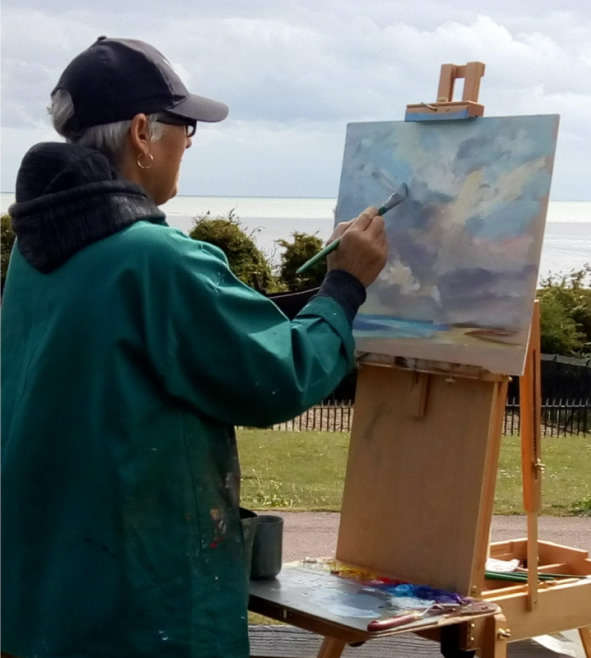 Mel Cambridge Purley artist painting at easel en plein air