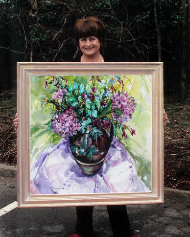Hildegarde Reid - Molesey Surrey Artist Holding Framed Painting
