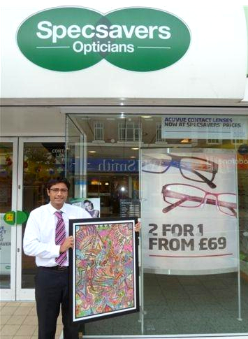 Mital Patel, Surrey Artist, displaying the painting selected for exhibit at London Rail Stations