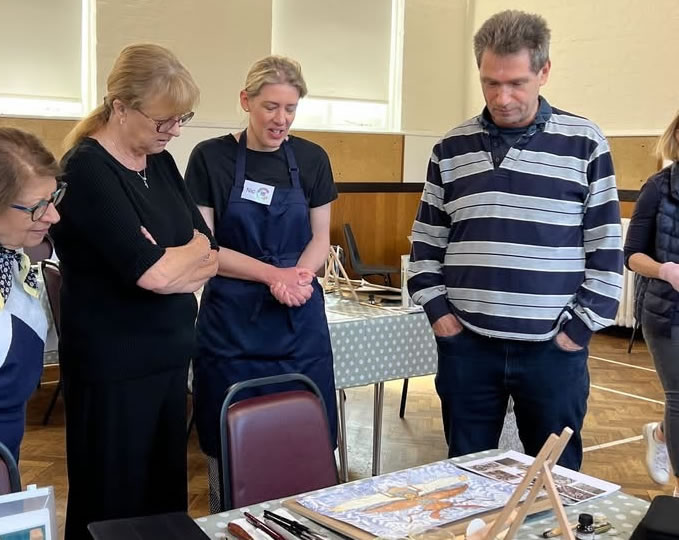 Art group members viewing Steampunk painting in Woking (Chobham)